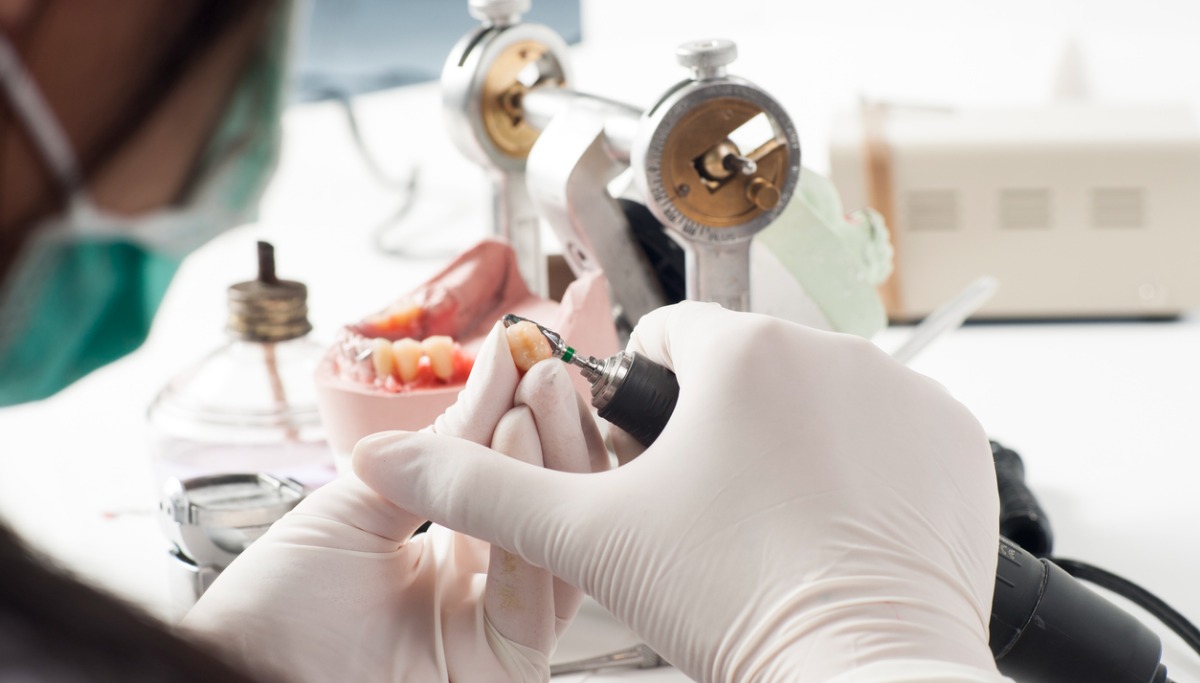 dental-technician-working-with-articulator-picture-id156285716